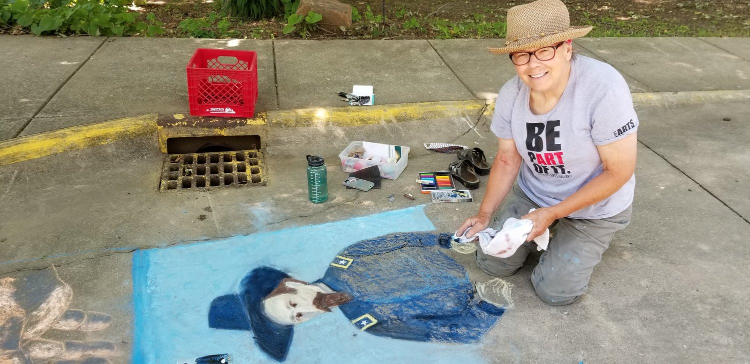 Artists and board members from Athens Arts Gallery visited the General Lew Wallace Study & Museum this week and created Lew Wallace-related chalk art to celebrate the museum’s reopening to the public. Pictured is Mary Lou Dawald.